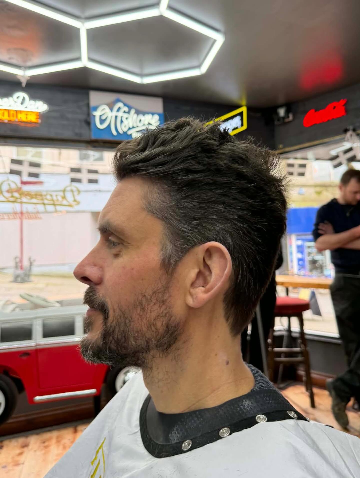 Man's textured crop haircut and trimmed beard