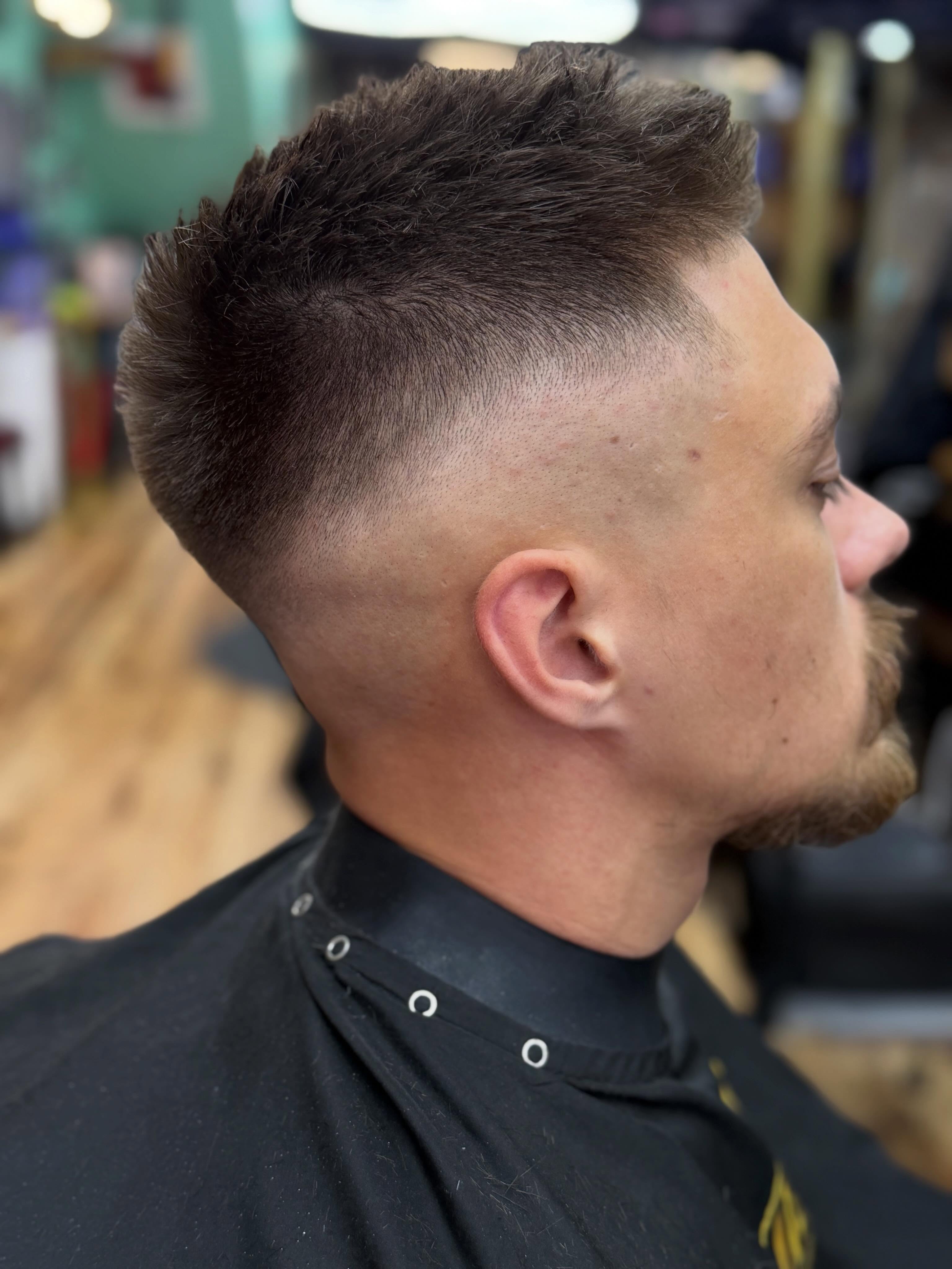 Skin fade haircut with a textured top
