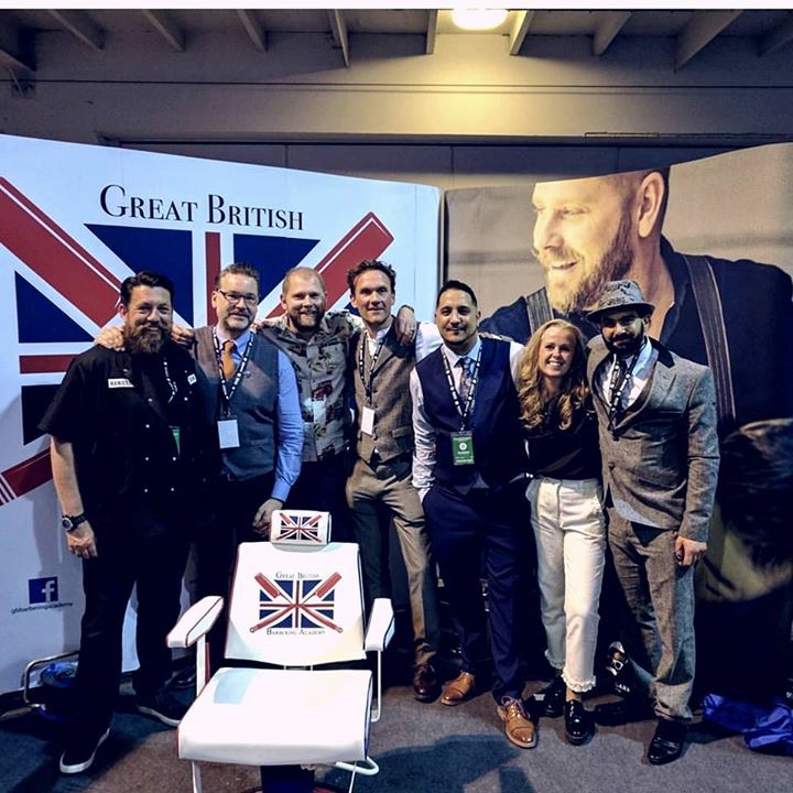A group photographed at a Great British Barbering Academy stand