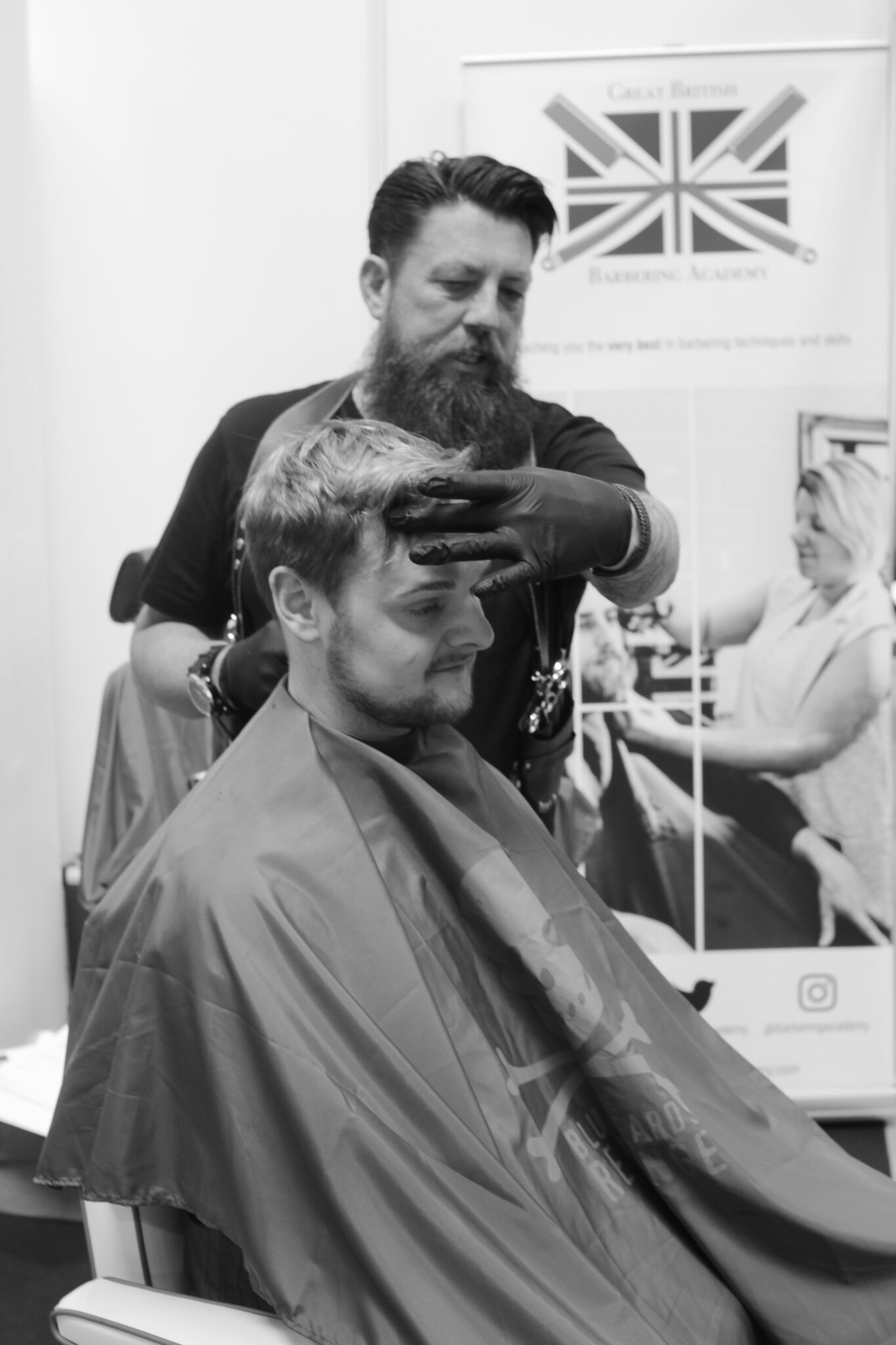 A barbering demonstration at a Great British Barbering Academy stand
