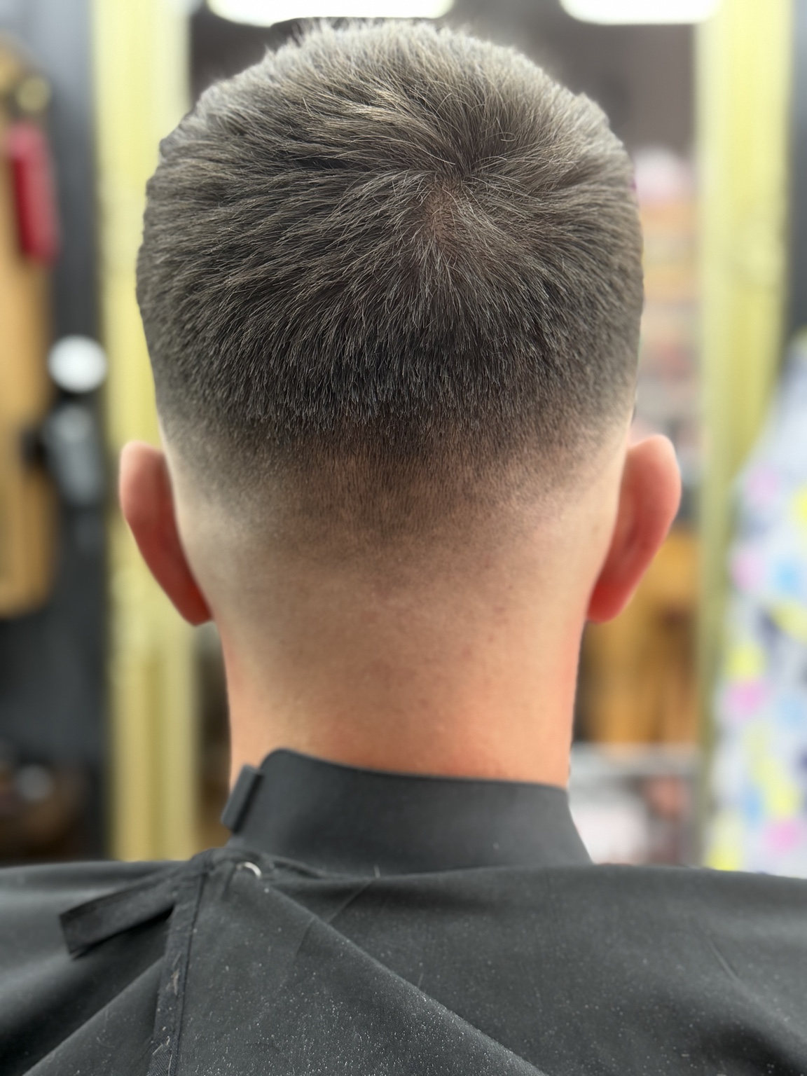 High skin fade haircut photographed from behind