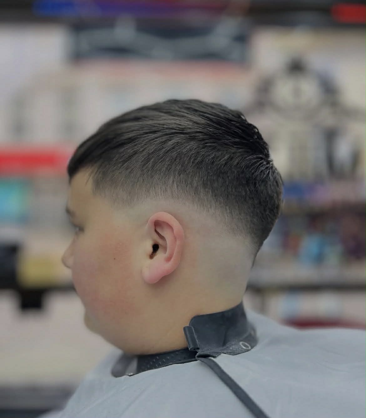 Side part haircut with a skin fade