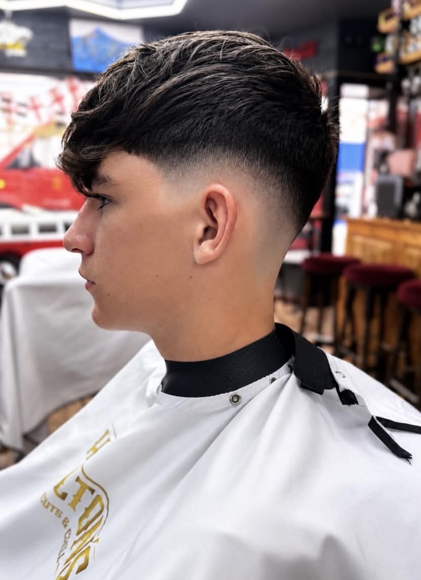 Textured crop haircut with a drop fade